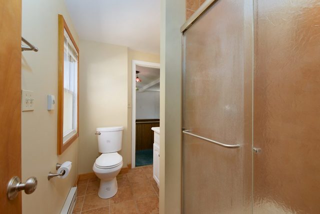 1875 Church Road Aurora, IL 60505 - Photo 14 of 26 a white toilet sitting next to a bathroom sink