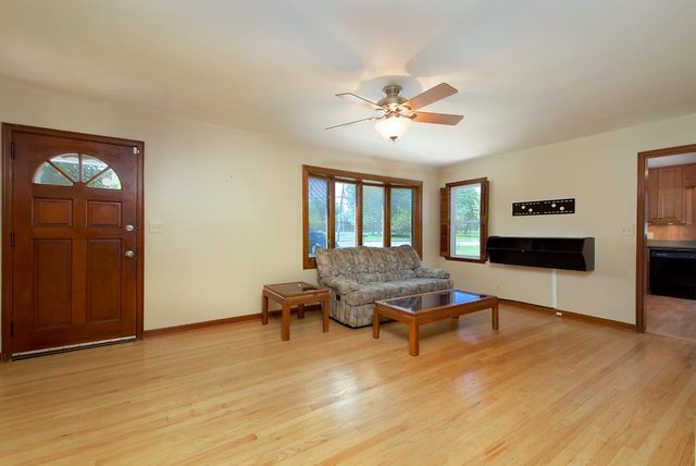 1875 Church Road Aurora, IL 60505 - Photo 3 of 26 a living room with furniture and wooden floor