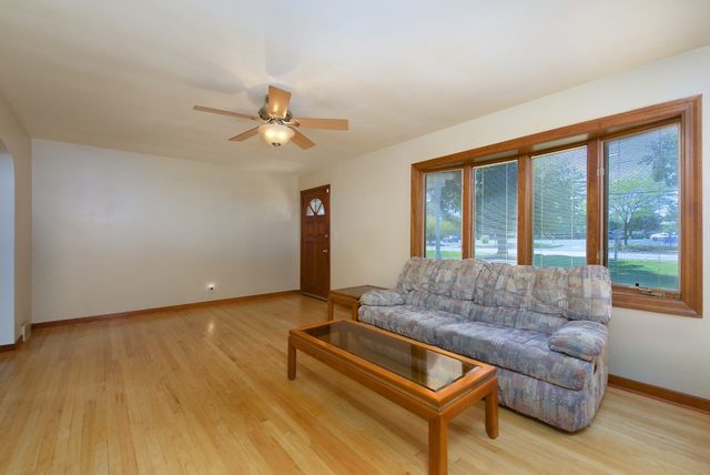 1875 Church Road Aurora, IL 60505 - Photo 4 of 26 a living room with furniture and a large window