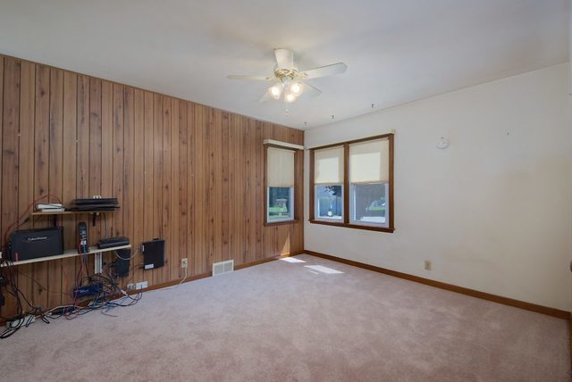 1875 Church Road Aurora, IL 60505 - Photo 9 of 26 a view of an empty room with a window