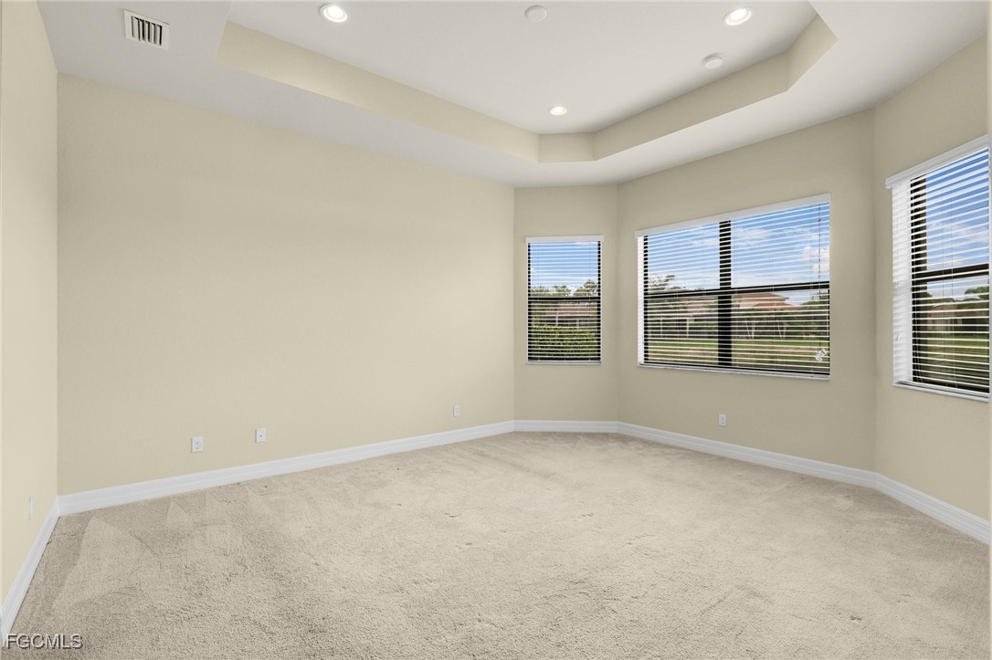 11643 Meadowrun Circle Fort Myers, FL 33913 - Photo 13 of 39 an empty room with windows
