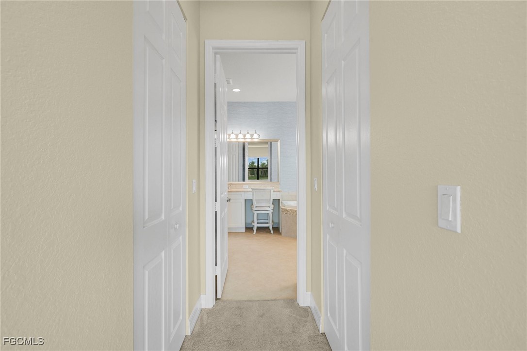 11643 Meadowrun Circle Fort Myers, FL 33913 - Photo 14 of 39 a view of a livingroom from a hallway