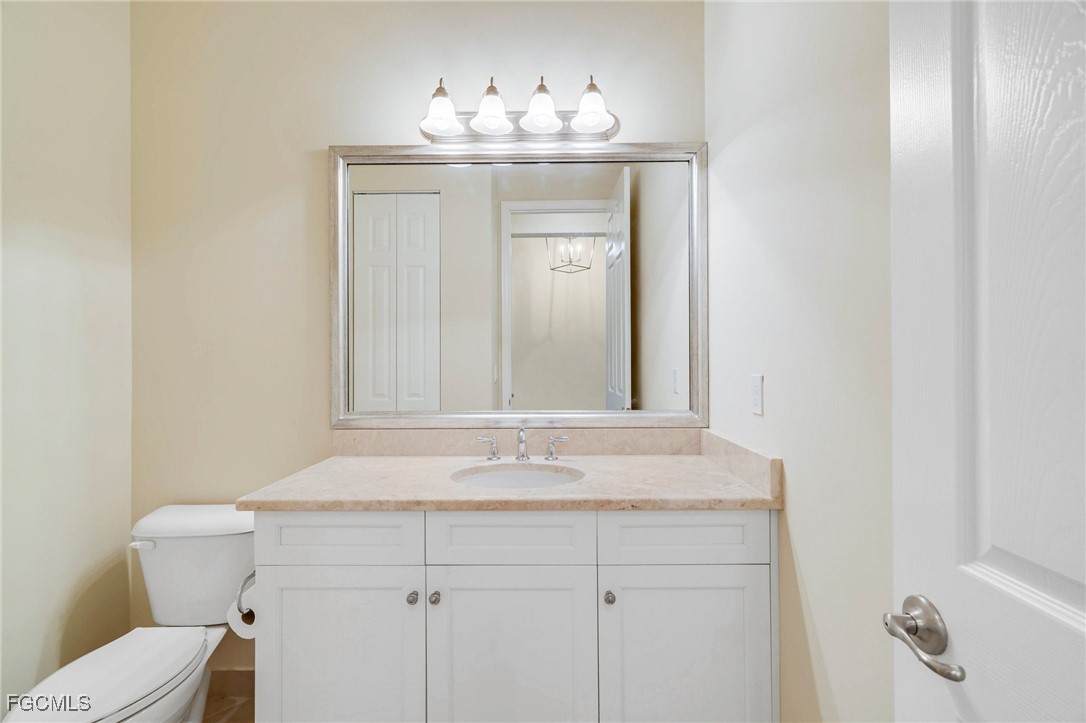 11643 Meadowrun Circle Fort Myers, FL 33913 - Photo 19 of 39 a bathroom with a sink and a toilet