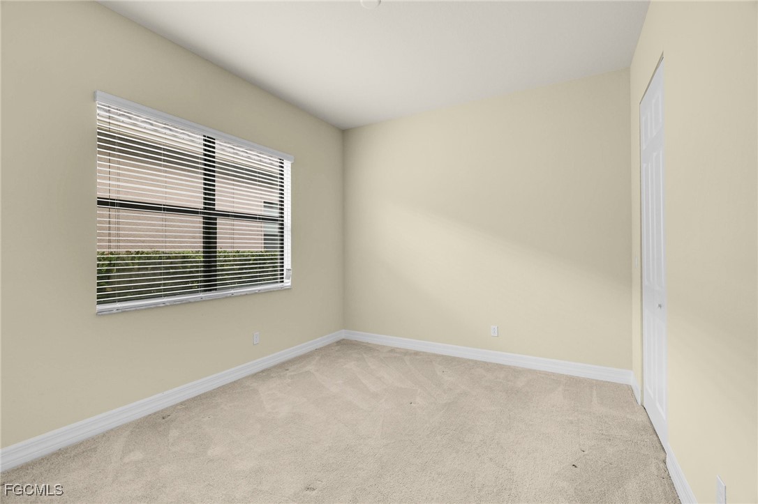 11643 Meadowrun Circle Fort Myers, FL 33913 - Photo 20 of 39 a view of an empty room with a window