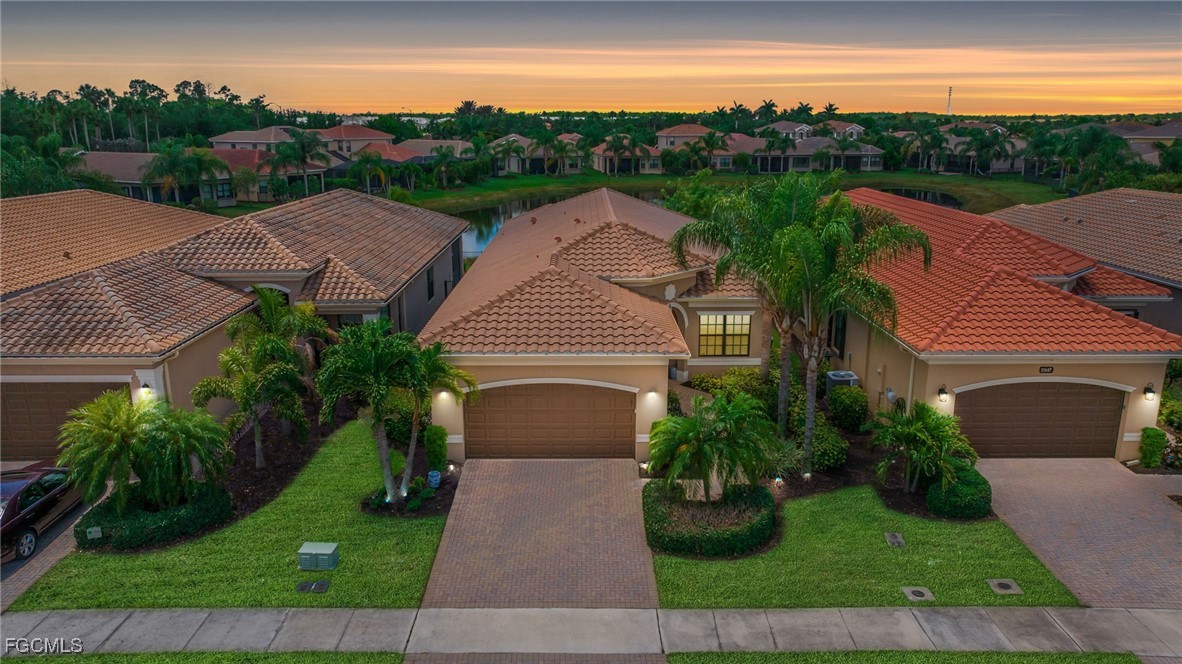 11643 Meadowrun Circle Fort Myers, FL 33913 - Photo 2 of 39 a aerial view of multiple houses with a yard
