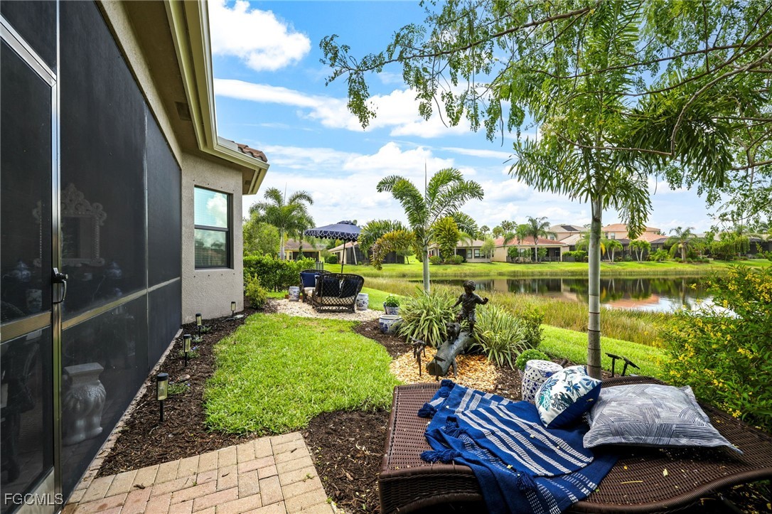 11643 Meadowrun Circle Fort Myers, FL 33913 - Photo 27 of 39 a view of a lake with couches chairs and a table