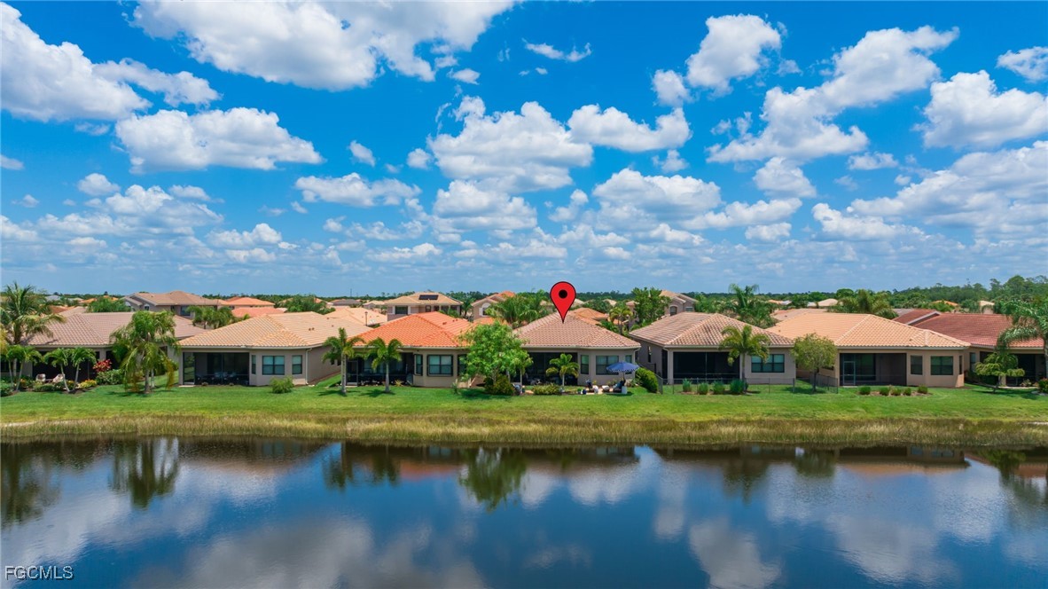 11643 Meadowrun Circle Fort Myers, FL 33913 - Photo 30 of 39 a view of house with garden and lake view
