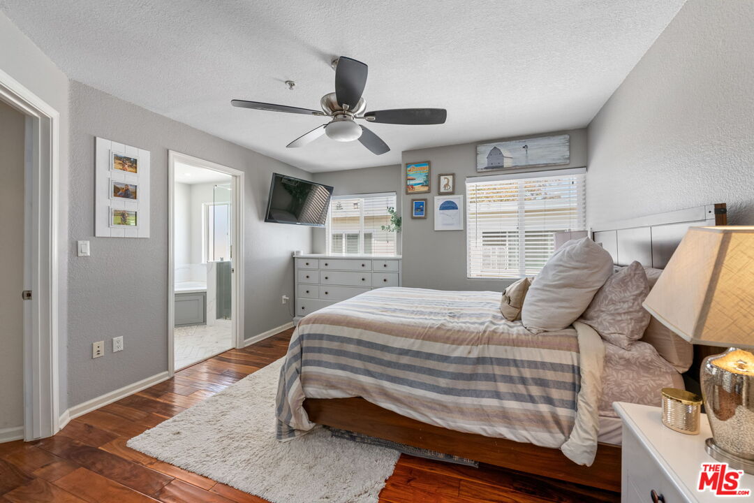 222 West Imperial Avenue, Unit 3 El Segundo, CA 90245 - Photo 11 of 24 a bedroom with a bed and wooden floor