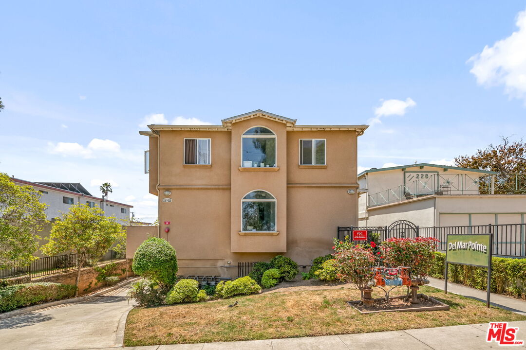 222 West Imperial Avenue, Unit 3 El Segundo, CA 90245 - Photo 20 of 24 a front view of a house with a yard