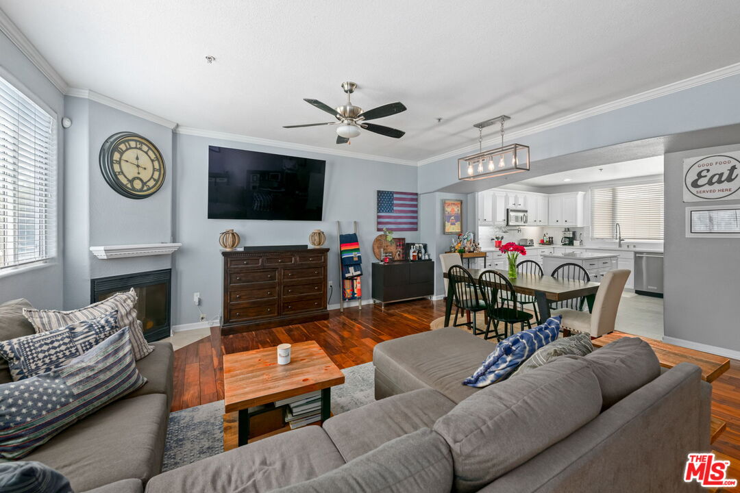 222 West Imperial Avenue, Unit 3 El Segundo, CA 90245 - Photo 3 of 24 a living room with furniture a flat screen tv and a fireplace