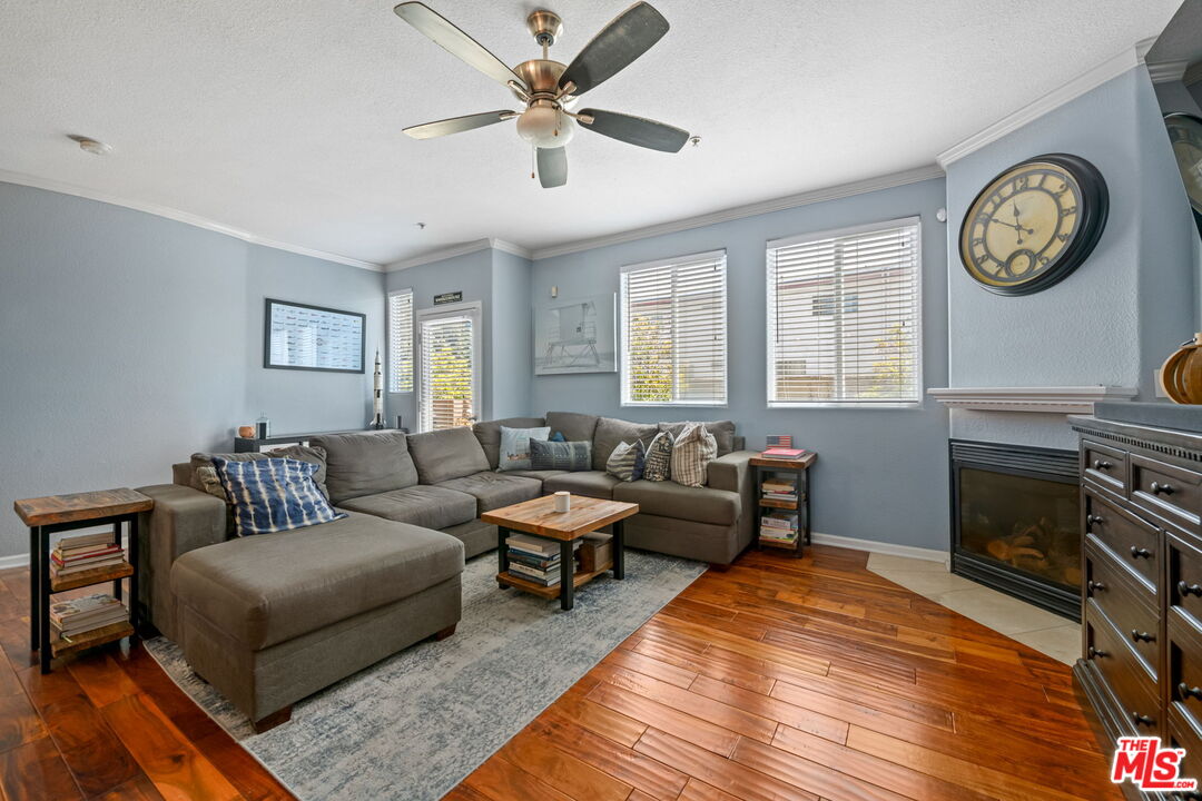 222 West Imperial Avenue, Unit 3 El Segundo, CA 90245 - Photo 4 of 24 a living room with furniture a clock and a window