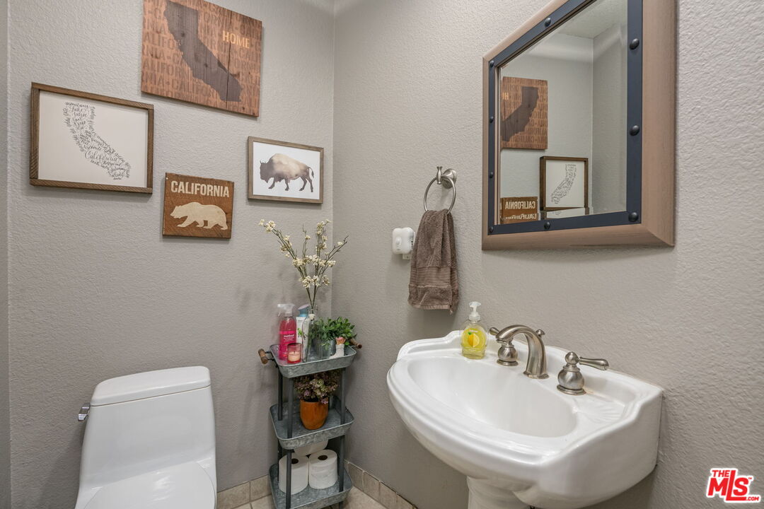 222 West Imperial Avenue, Unit 3 El Segundo, CA 90245 - Photo 8 of 24 a bathroom with a toilet a sink and a mirror
