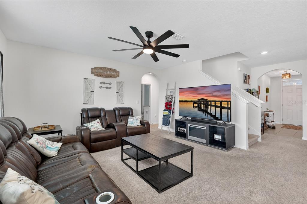 1809 Myrtlebrooke Drive Edgewater, FL 32141 - Photo 10 of 58 a living room with furniture and a flat screen tv