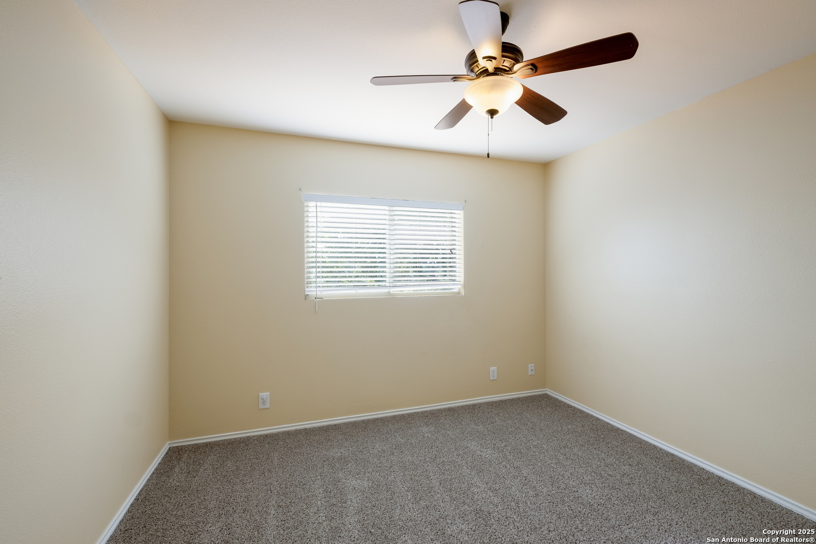 249 Michelle Lane Boerne, TX 78006 - Photo 15 of 17 an empty room with a window and a fan