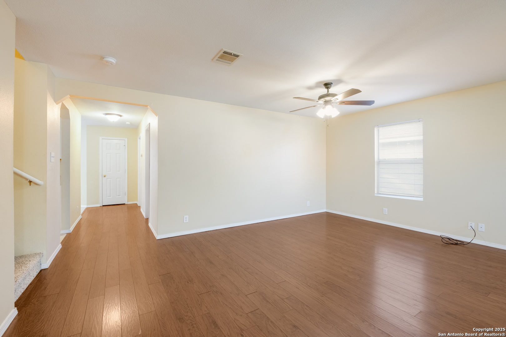 249 Michelle Lane Boerne, TX 78006 - Photo 4 of 17 wooden floor in an empty room with a window