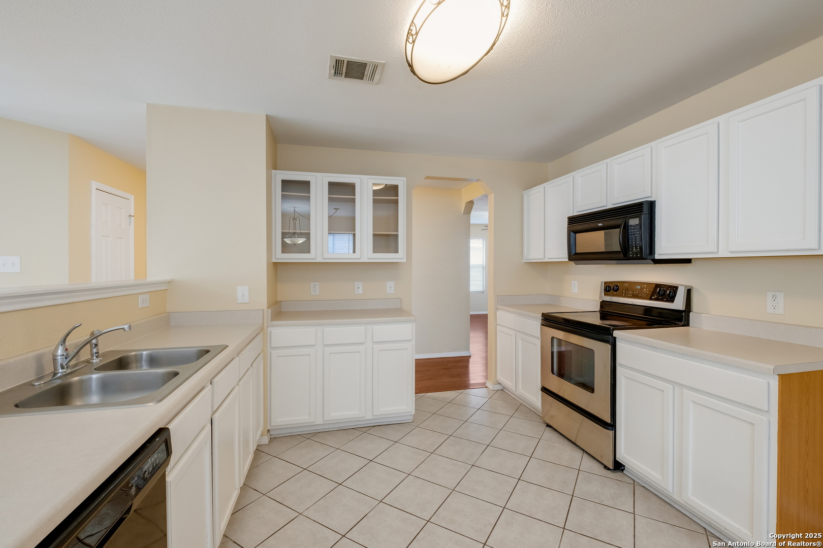 249 Michelle Lane Boerne, TX 78006 - Photo 6 of 17 a kitchen with granite countertop a sink stainless steel appliances and cabinets