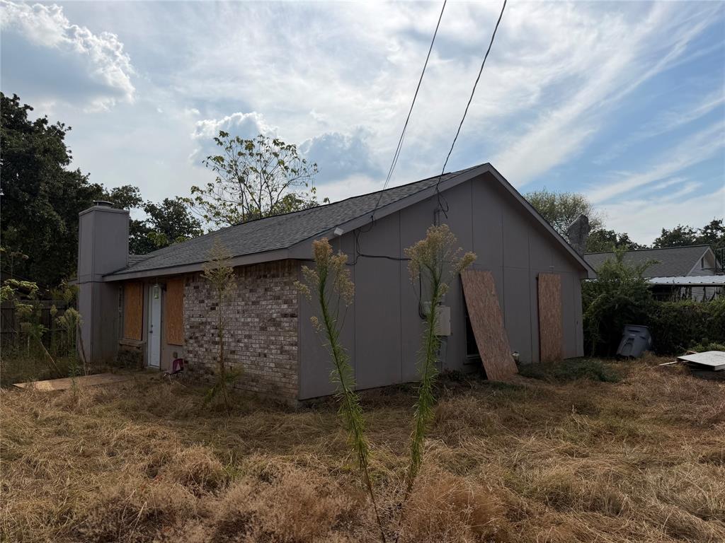 10823 Addie Road Dallas, TX 75217 - Photo 19 of 20 Single-story structure with a gray shingle roof