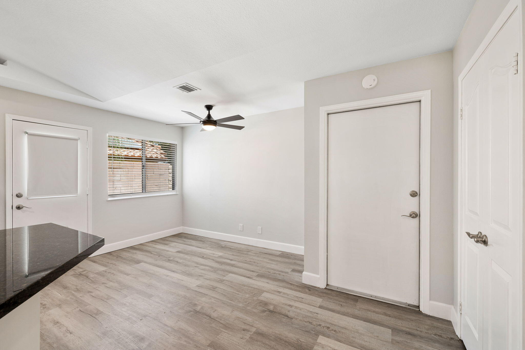 39495 Regency Way Palm Desert, CA 92211 - Photo 14 of 55 an empty room with windows and closet