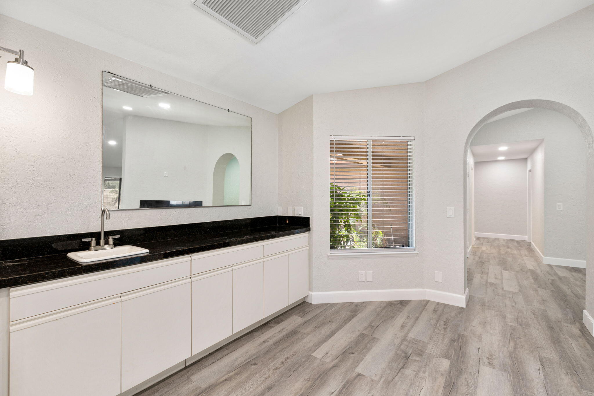 39495 Regency Way Palm Desert, CA 92211 - Photo 15 of 55 a bathroom with a sink and a mirror