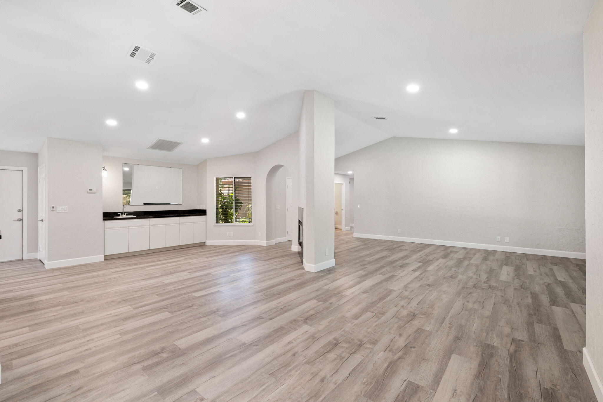 39495 Regency Way Palm Desert, CA 92211 - Photo 16 of 55 a view of an empty room with wooden floor