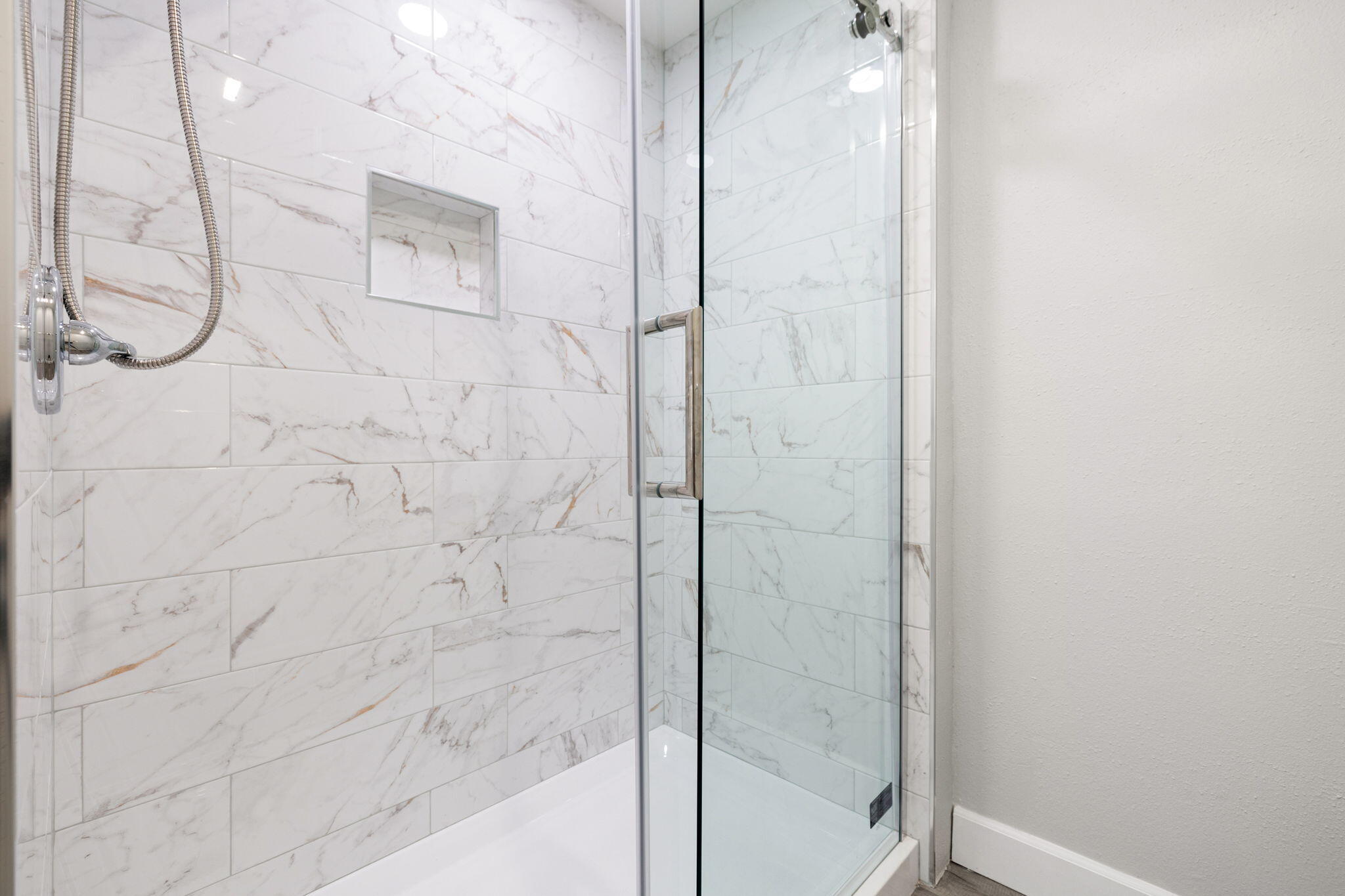 39495 Regency Way Palm Desert, CA 92211 - Photo 28 of 55 a bathroom with a glass shower door