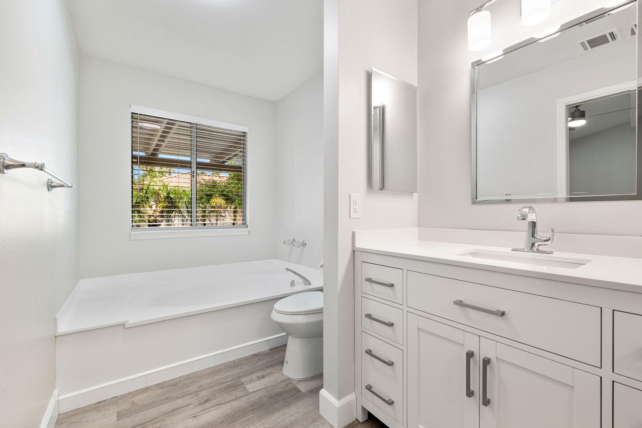 39495 Regency Way Palm Desert, CA 92211 - Photo 30 of 55 a bathroom with a granite countertop toilet sink and mirror