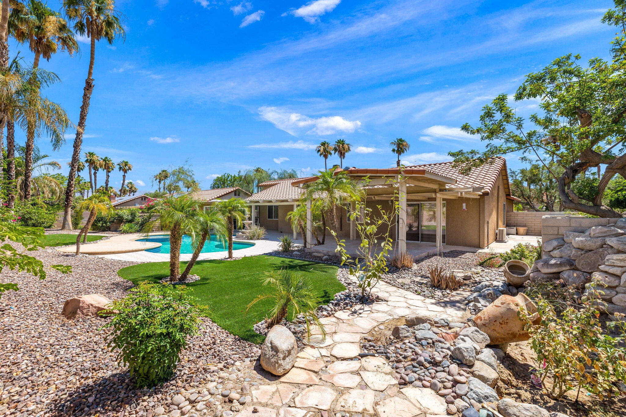 39495 Regency Way Palm Desert, CA 92211 - Photo 39 of 55 a view of a street with a building in the background