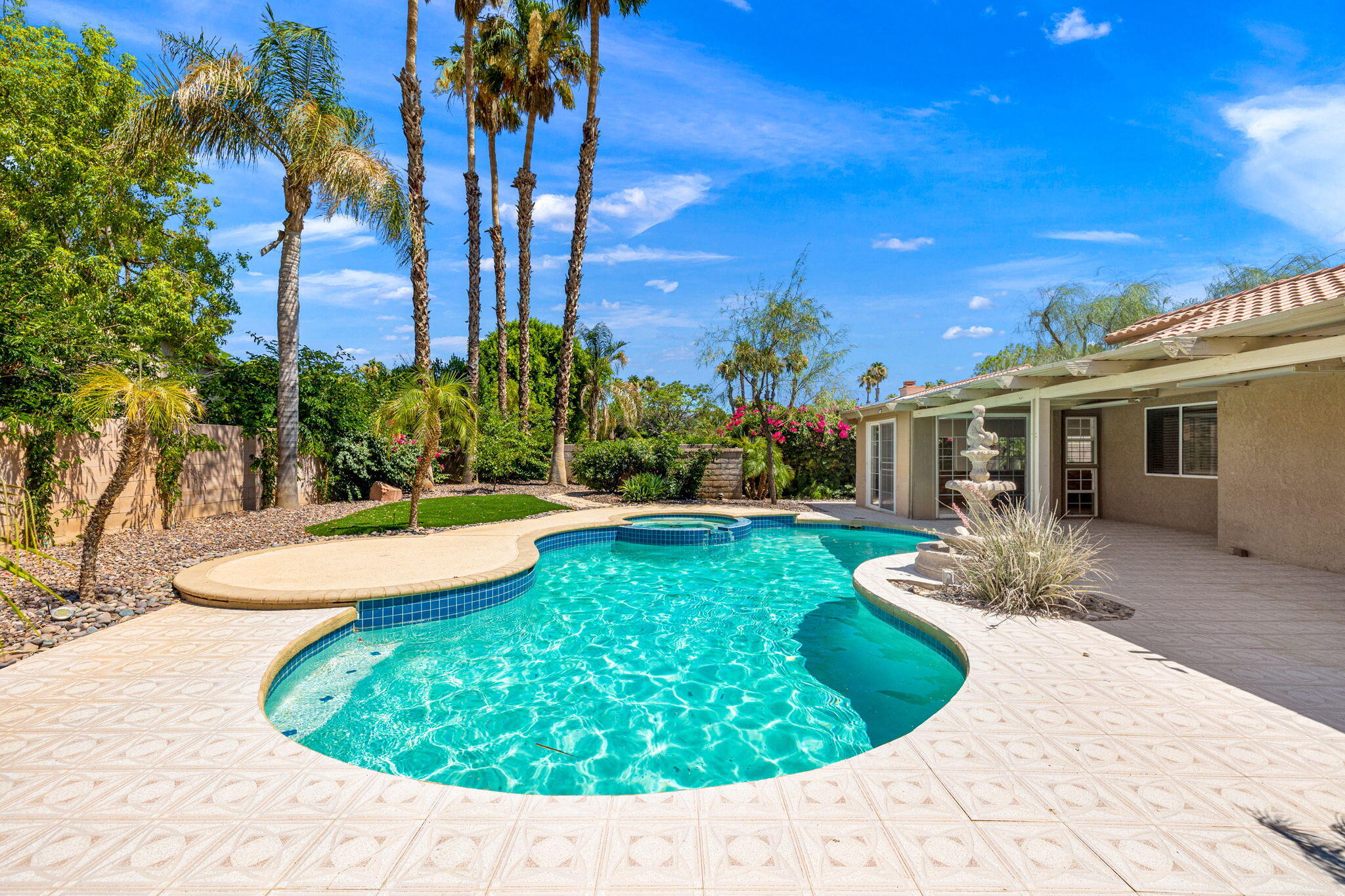 39495 Regency Way Palm Desert, CA 92211 - Photo 40 of 55 a view of a backyard with plants and palm tree
