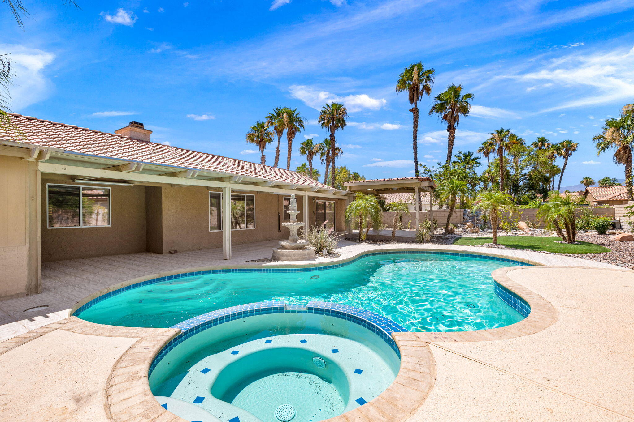 39495 Regency Way Palm Desert, CA 92211 - Photo 43 of 55 a view of a house with a swimming pool