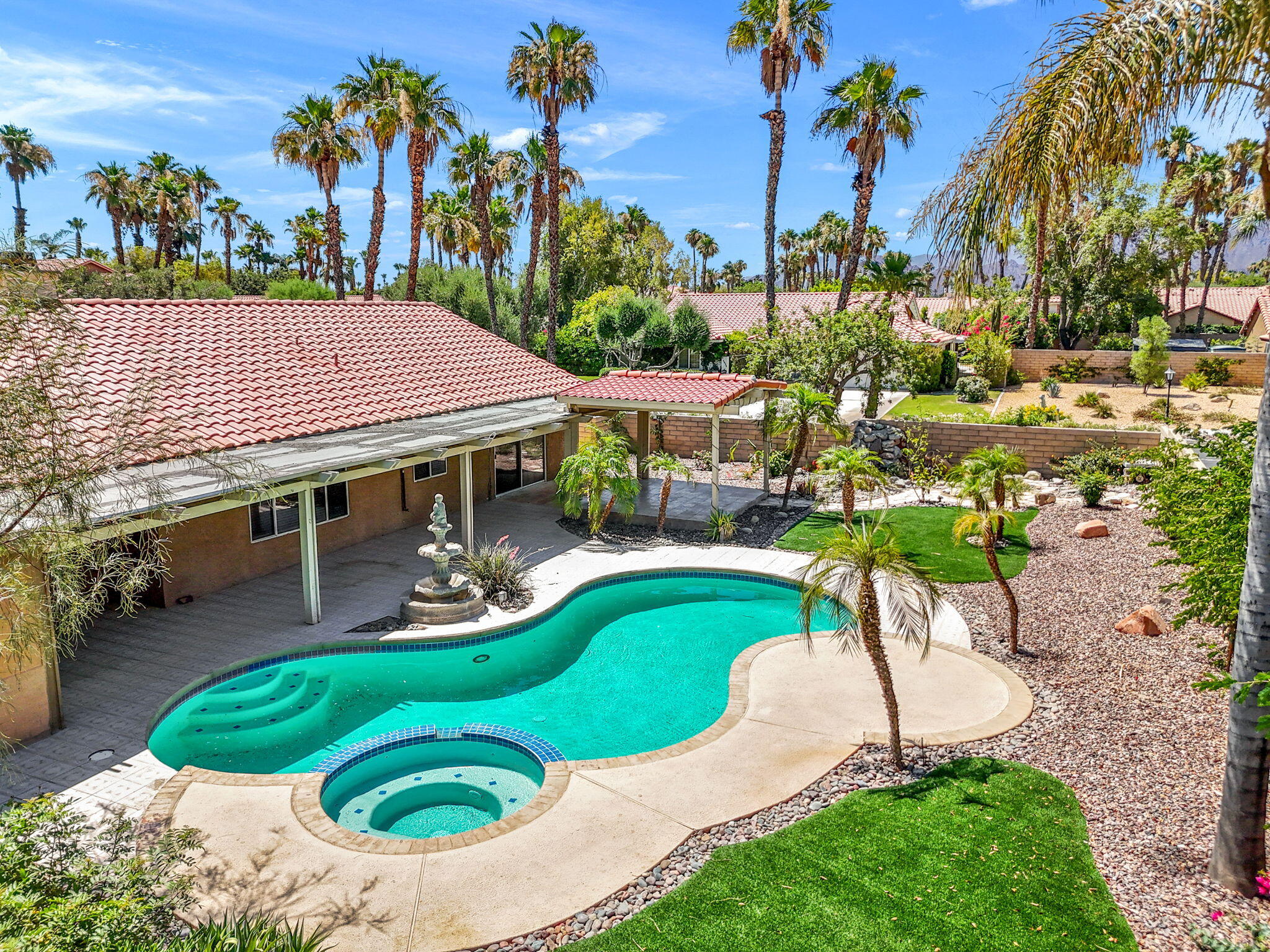 39495 Regency Way Palm Desert, CA 92211 - Photo 46 of 55 an aerial view of a house with garden space and swimming pool
