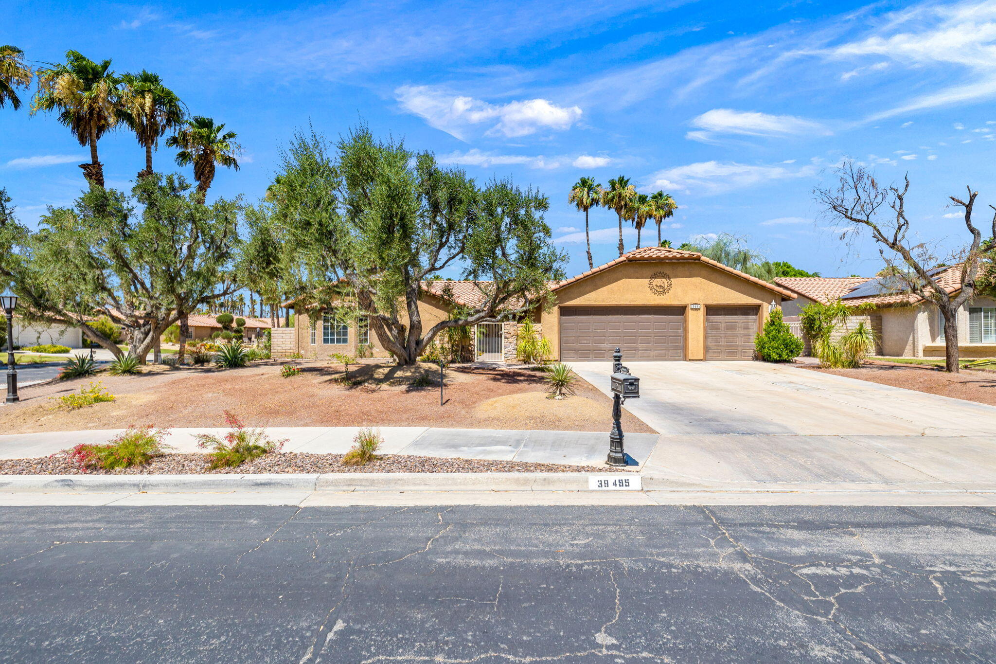 39495 Regency Way Palm Desert, CA 92211 - Photo 52 of 55 a front view of a house with a yard