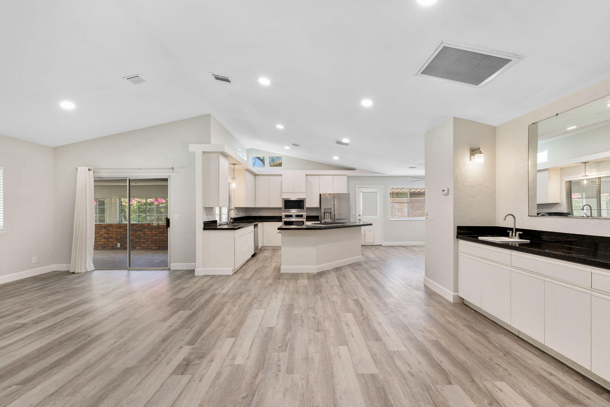 39495 Regency Way Palm Desert, CA 92211 - Photo 8 of 55 a view of a kitchen with cabinets stainless steel appliances a sink and a counter top space