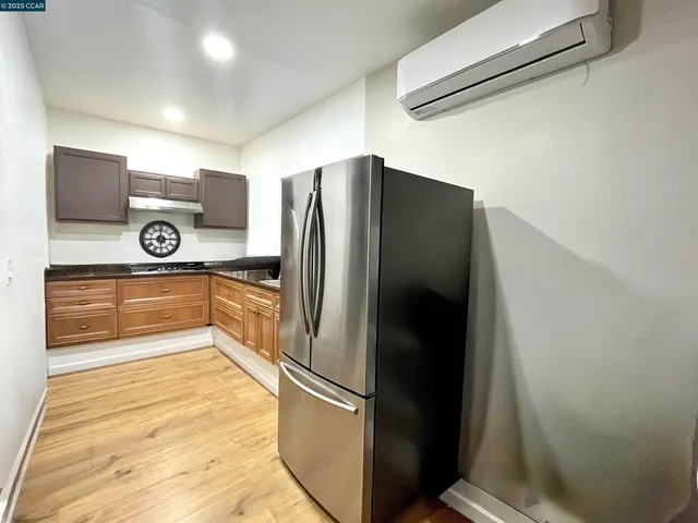 a view of kitchen with wooden floor