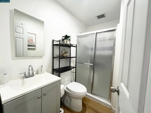 a bedroom with a bed and a table