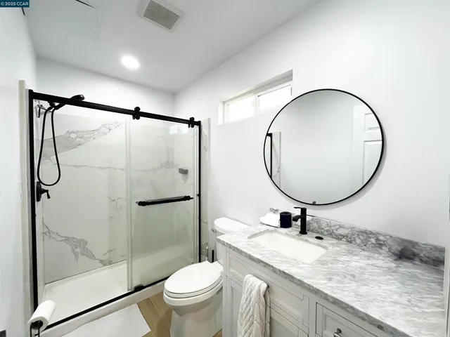 a swimming pool with outdoor seating and garden