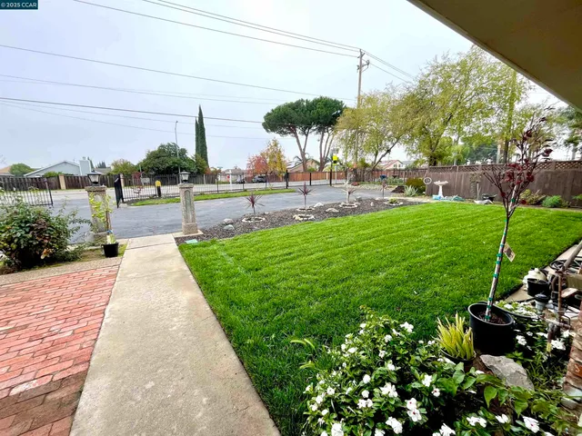 a view of a garden with a houses
