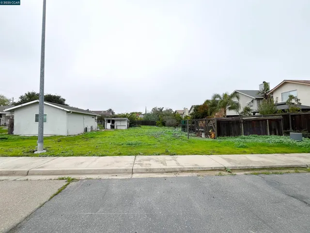 a view of a patio with couches and table with garden