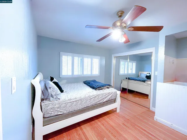 a bedroom with a bed and window