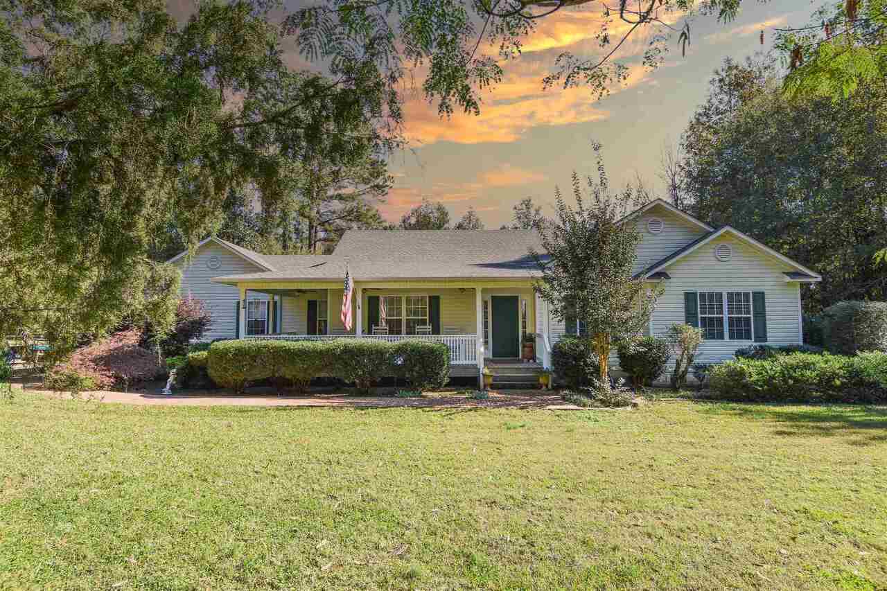 1955 Strickland Road Concord, GA 30206 - Photo 1 of 1 a front view of a house with a yard porch and outdoor seating