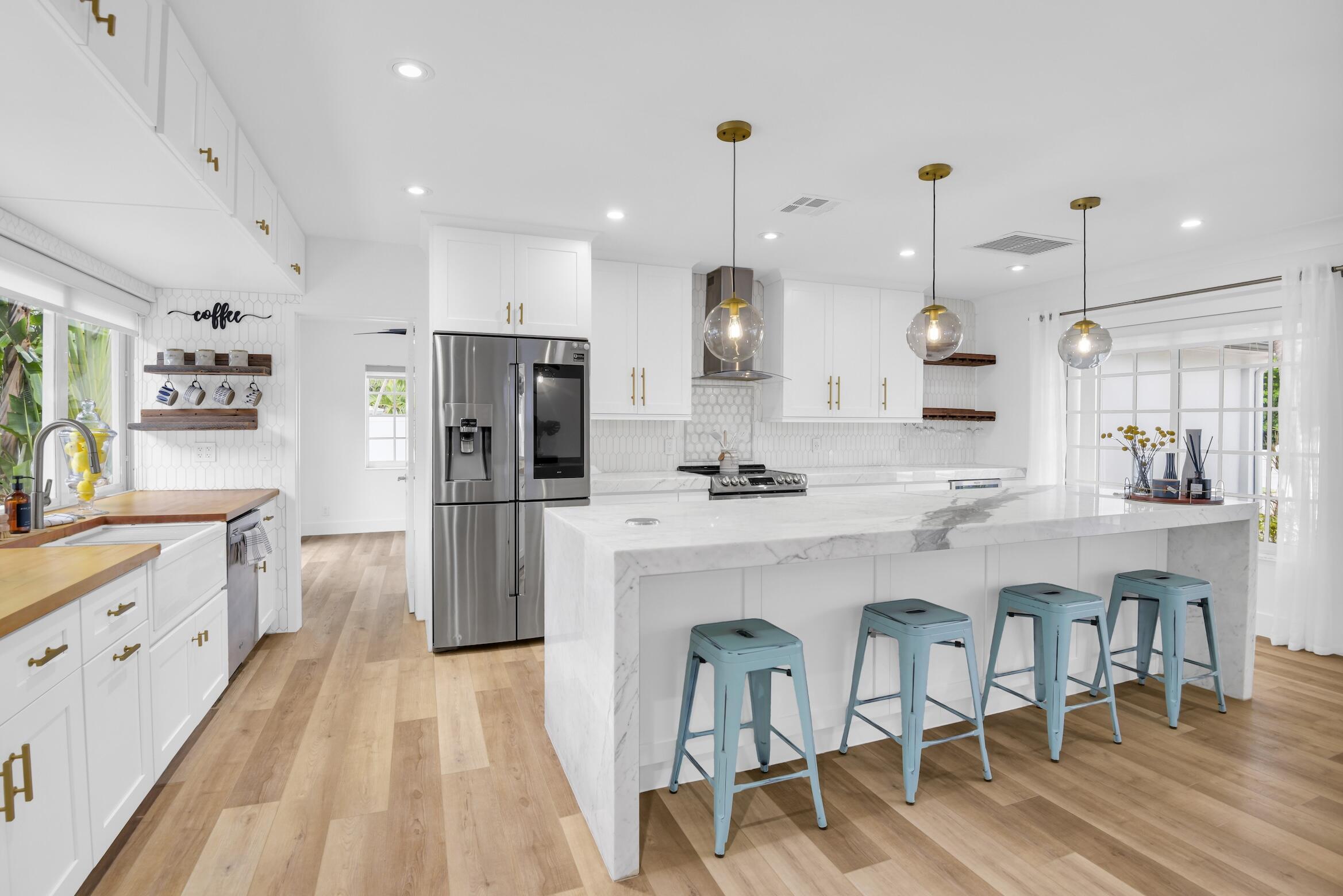 701 Appleby Street Boca Raton, FL 33487 - Photo 38 of 47 a large kitchen with a table and chairs