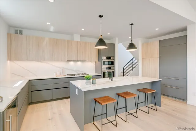 a view of a living room and workspace