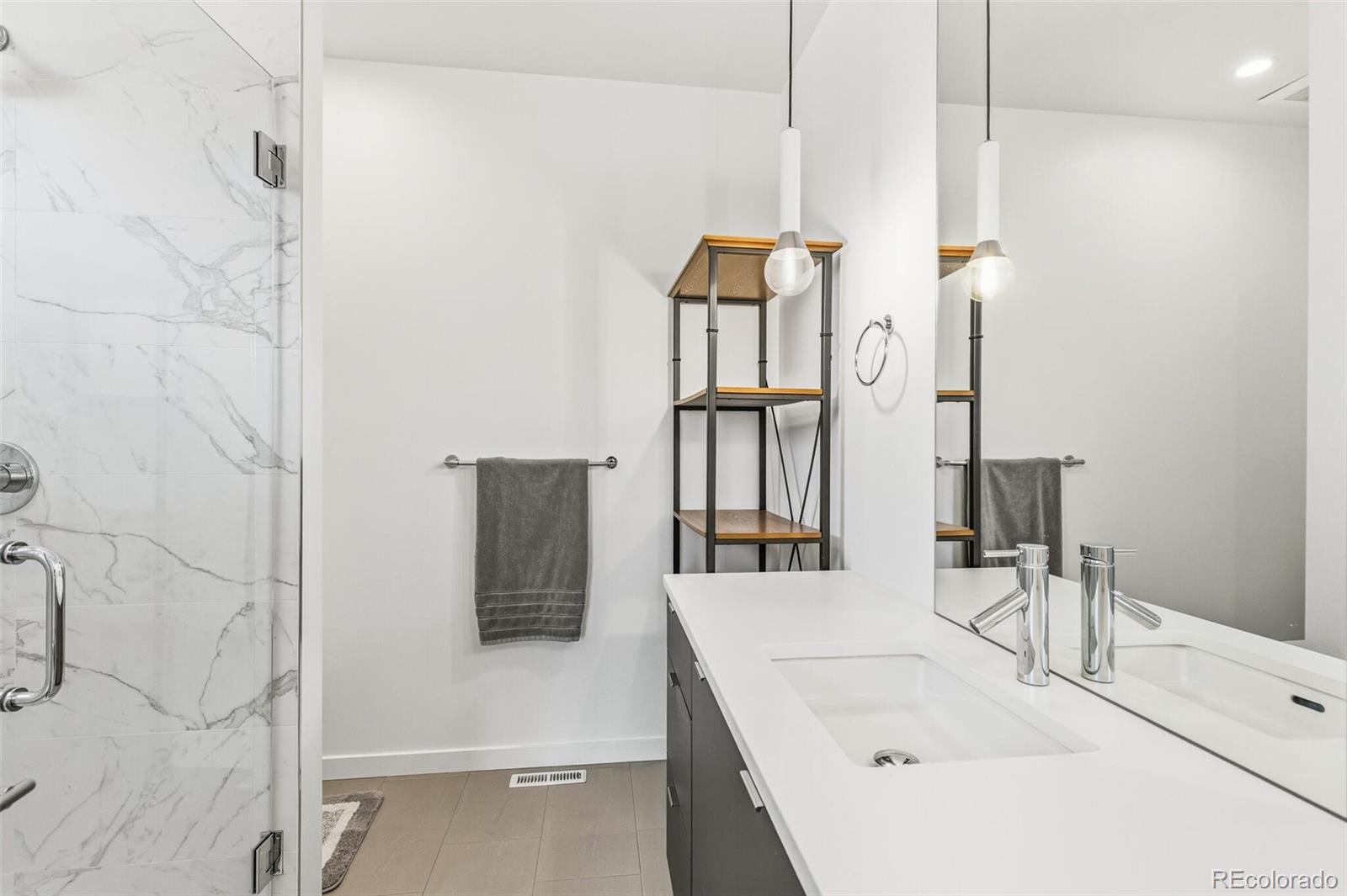 4077 Everett Street Wheat Ridge, CO 80033 - Photo 23 of 50 a bathroom with a bathtub and a sink