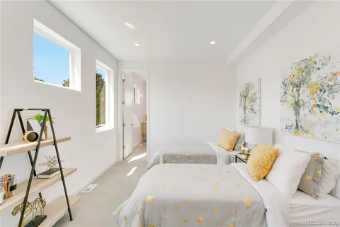 a spacious bedroom with a bed and a window