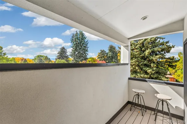 a backyard of a house with lots of green space and garden in back