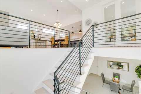 a view of a patio with couches table and chairs and potted plants