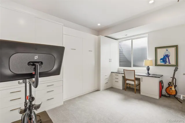 a view of a garden with a building in the background