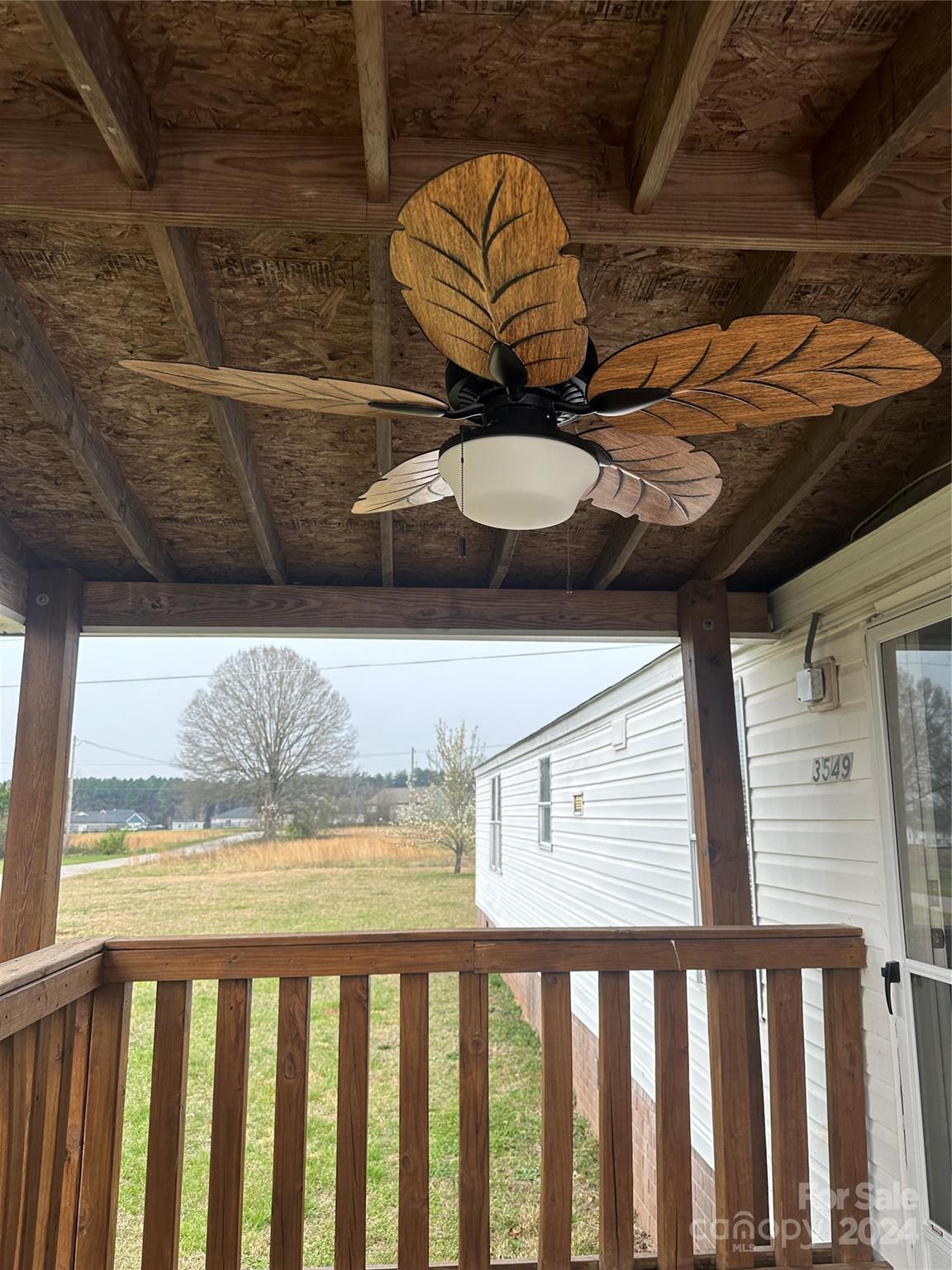 3549 Keystone Drive Sherrills Ford, NC 28673 - Photo 12 of 25 a view of a porch with a table and chairs