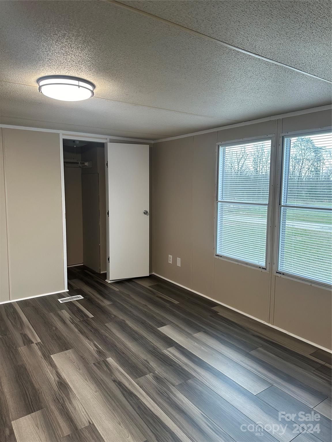 3549 Keystone Drive Sherrills Ford, NC 28673 - Photo 14 of 25 a view of an empty room with wooden floor and a window