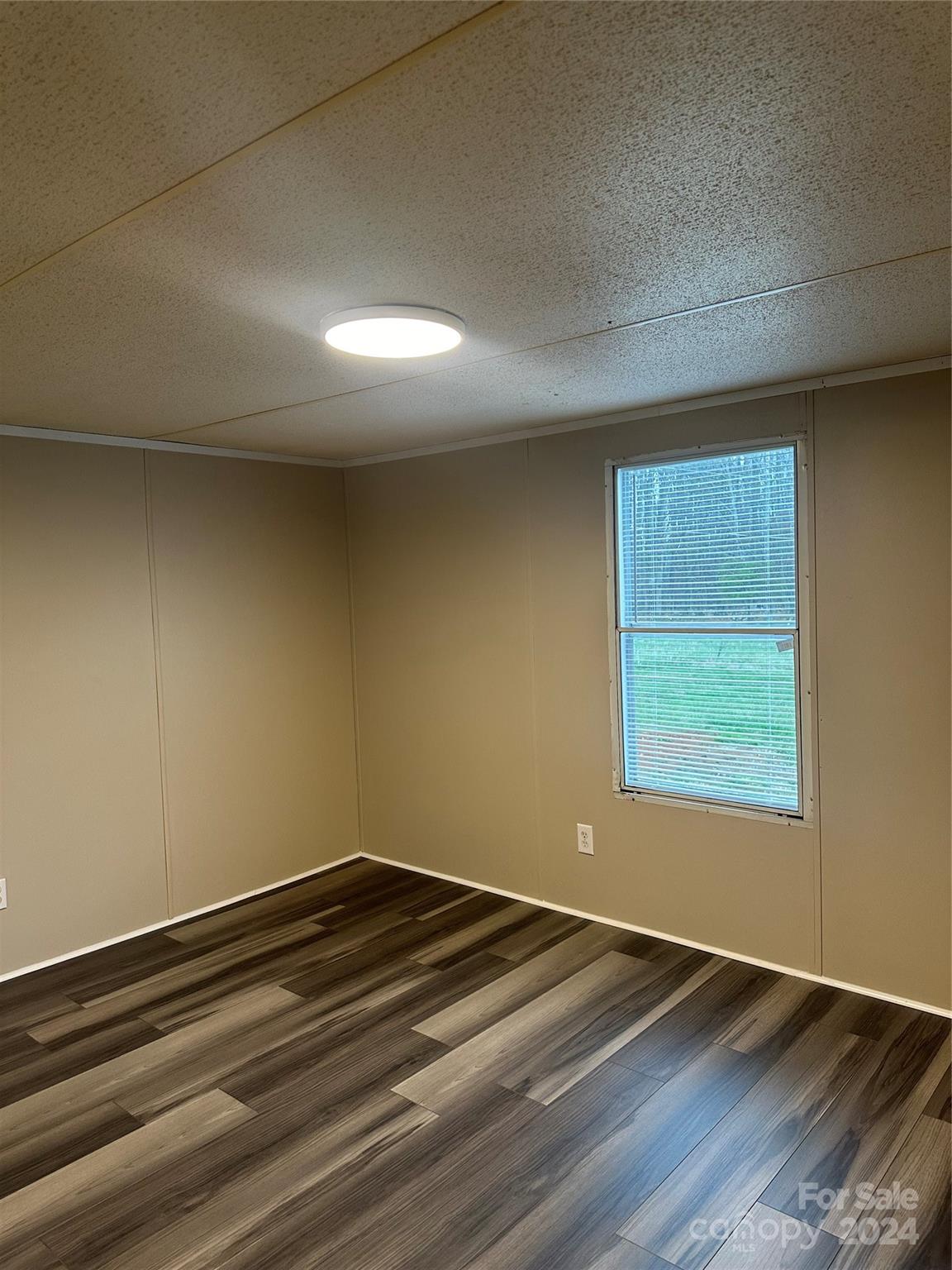 3549 Keystone Drive Sherrills Ford, NC 28673 - Photo 19 of 25 a view of empty room with window and wooden floor