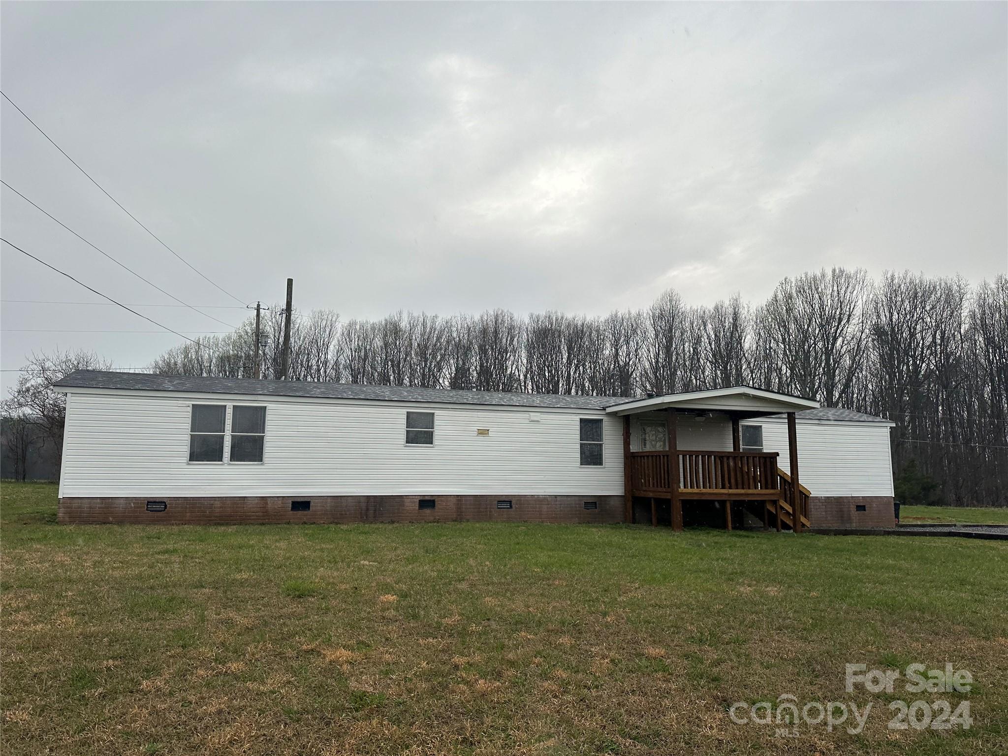 3549 Keystone Drive Sherrills Ford, NC 28673 - Photo 24 of 25 a front view of house with yard and trees in the background
